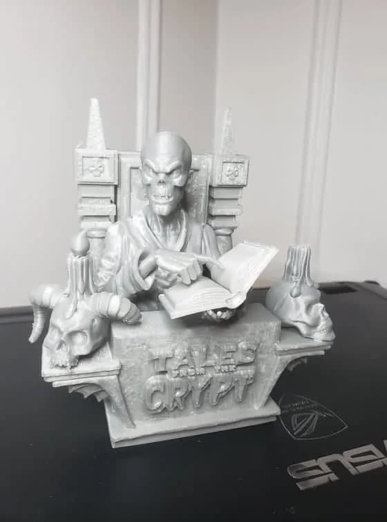 STL - Figura de calavera leyendo en trono render 1